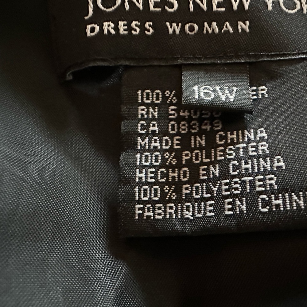 Solid black dress that is mid shin or maxi depending on your height.